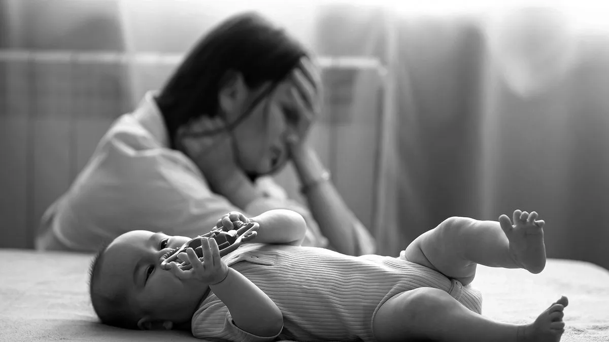 A mother experiencing emotional responsibility during the postpartum period